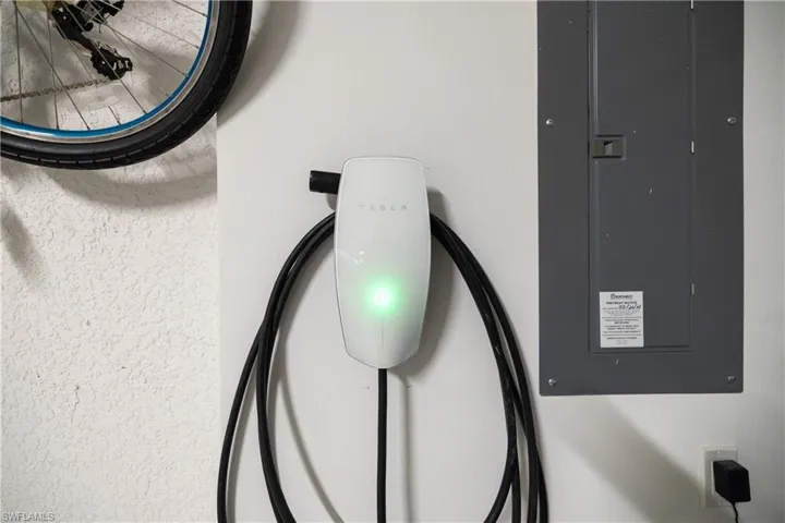 Wall-mounted electric vehicle charging station