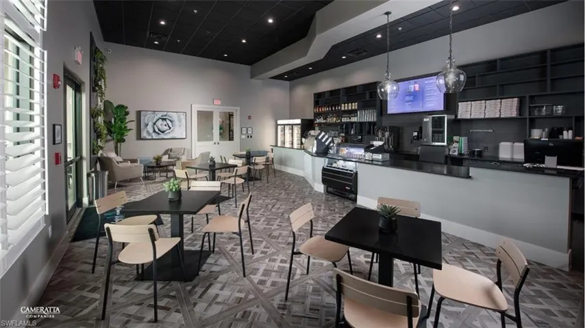 Dining space featuring a high ceiling and recessed lighting