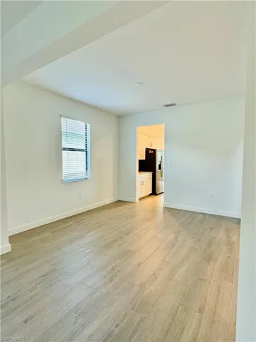 Unfurnished room featuring light wood-style floors