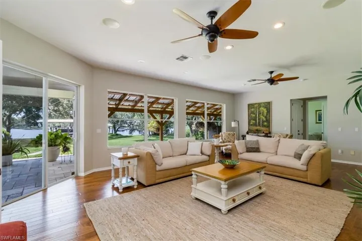 In-Law Suite Living room featuring ceiling fan, hardwood / wood-style flooring, and a wealth of natural light
