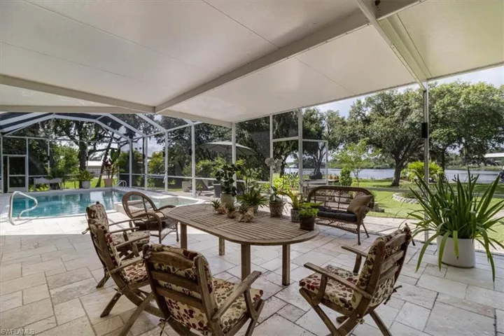 Sunroom / solarium featuring beamed ceiling
