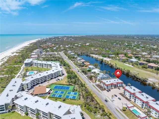 Birds eye view of property featuring a water view