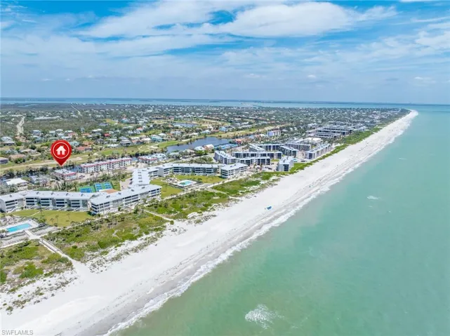 Bird's eye view featuring a view of the beach and a water view
