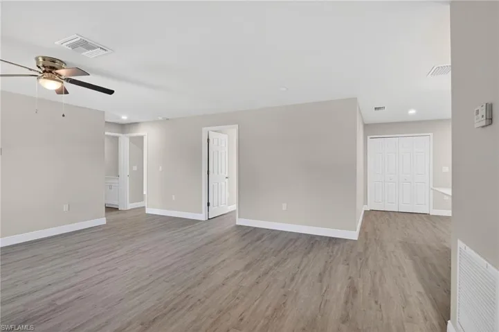Unfurnished room with a ceiling fan, recessed lighting, and light wood-type flooring