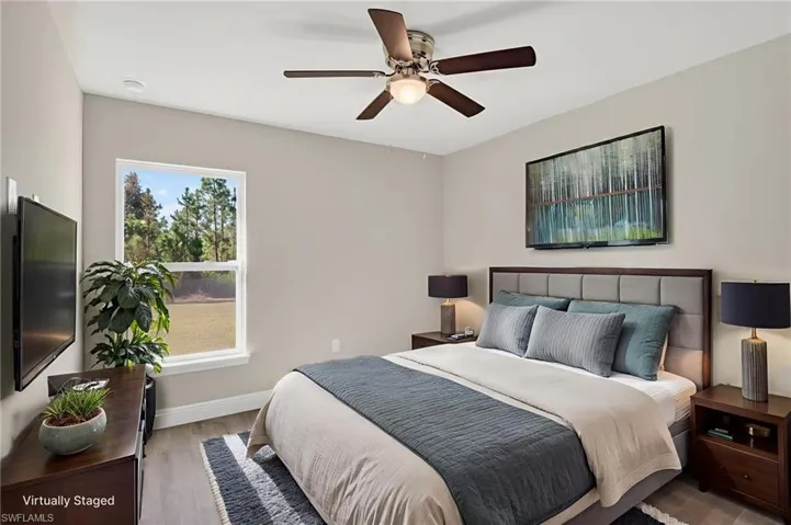 Bedroom with light wood-type flooring and ceiling fan