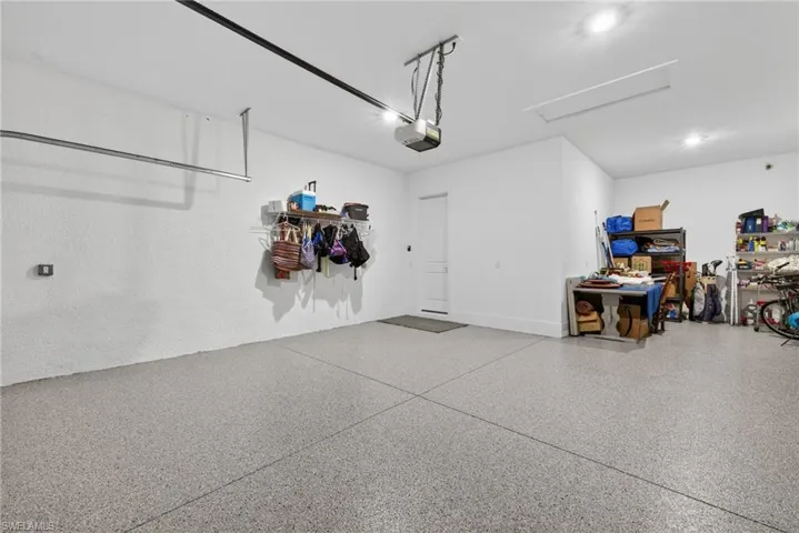 Garage featuring a garage door opener