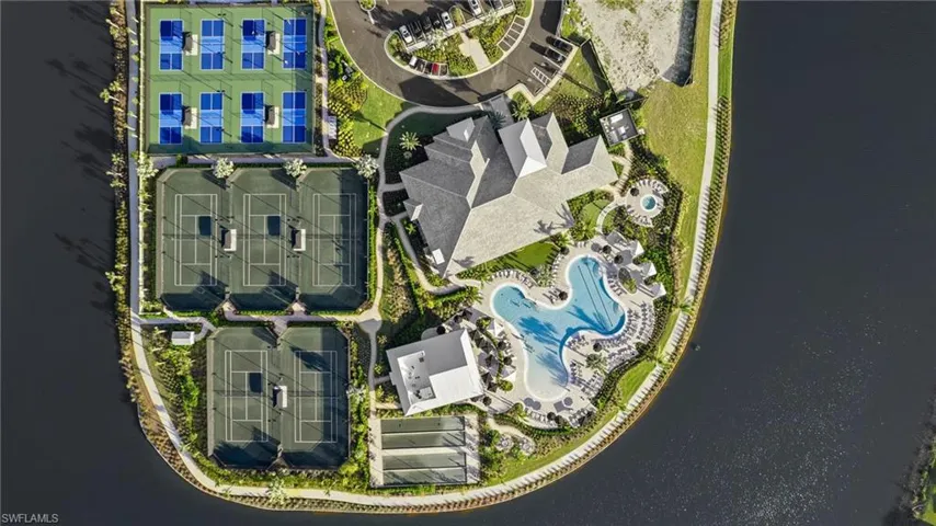 Drone / aerial view of a pool and a large body of water