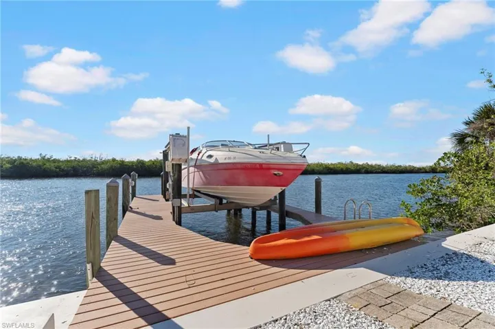 View of dock featuring a water view and boat lift