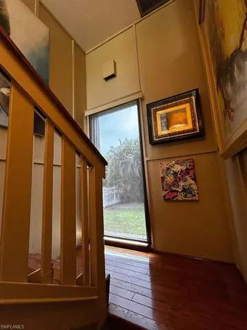 Doorway to outside featuring hardwood / wood-style flooring