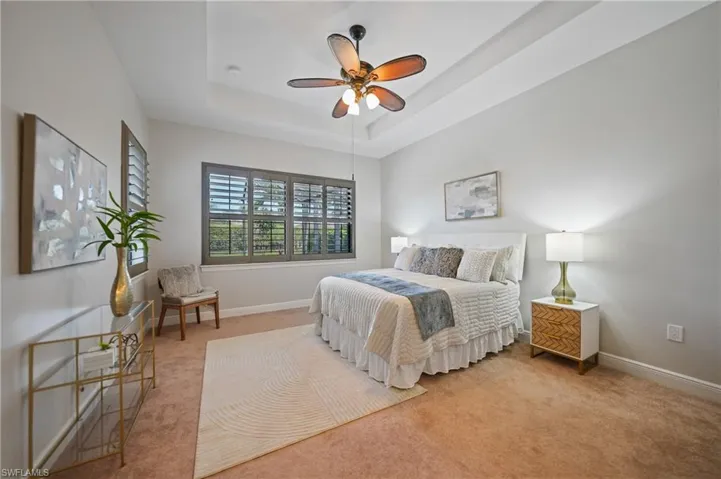 Primary Master comes nicely appointed with try ceilings, plantation shutters and his and hers walk in closets.