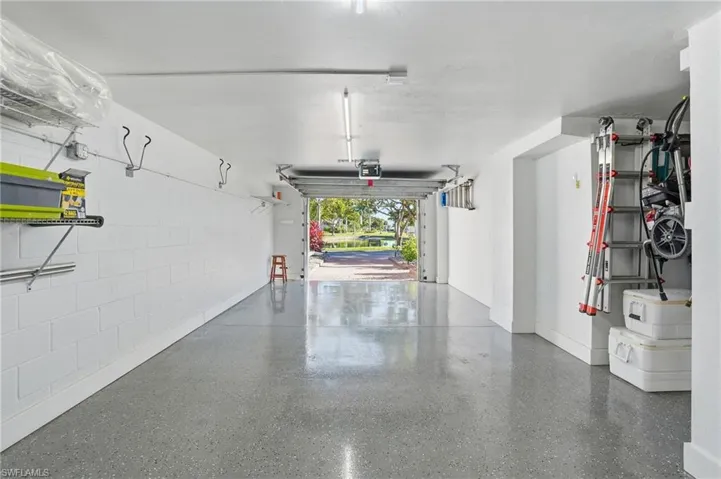Garage featuring baseboards