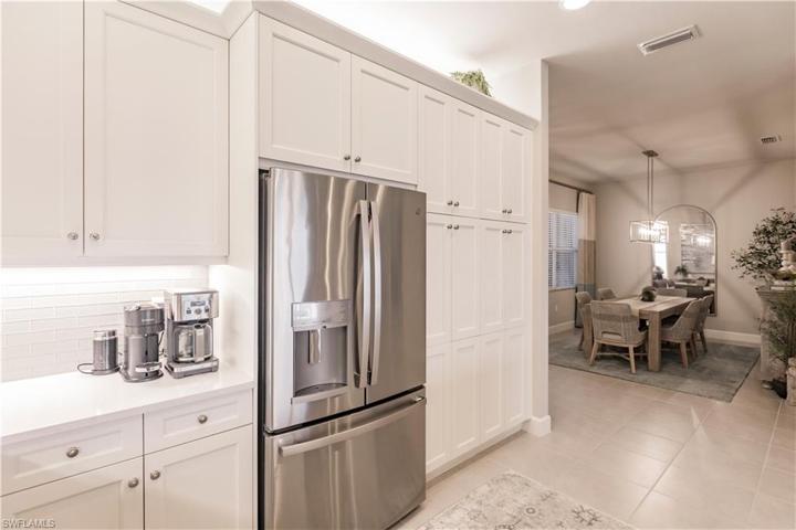 No entry level stainless package here.  There is a cabinet depth French door refrigerator with door water and ice along with the rest of the matching suite.  Be sure to check out the abundant storage in the upgraded dual pantry cabinets.