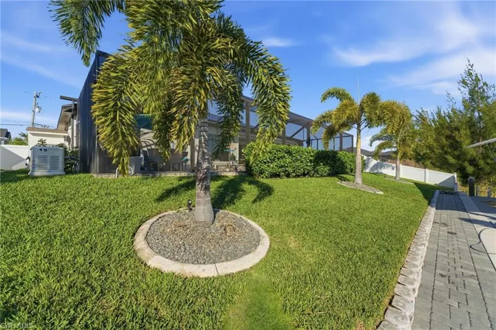 View of yard with glass enclosure