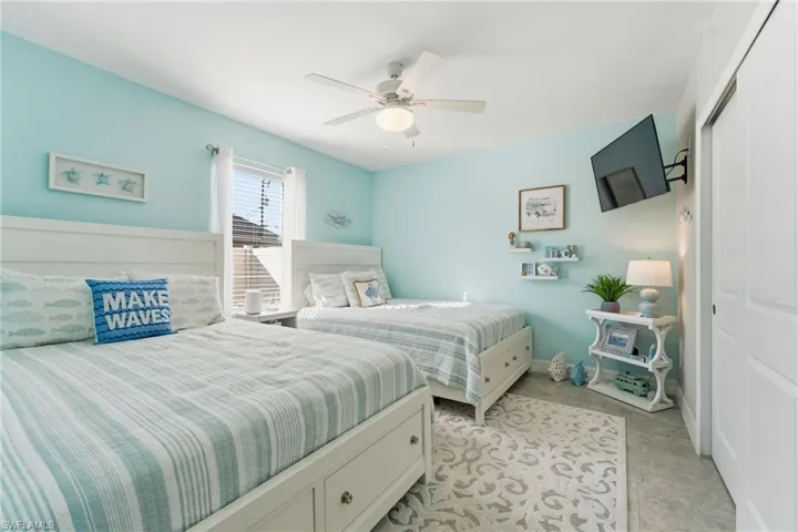 Bedroom featuring ceiling fan and a closet