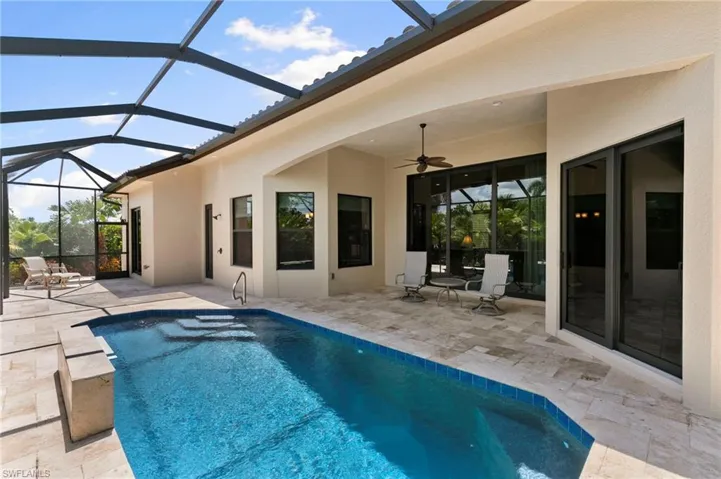 Beautiful pool and deck with multiple seating areas