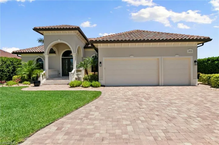 3 car garage and paver driveway