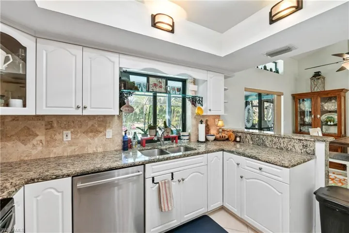 Granite Countertops, Stainless Steel Applicances and Convenient Passthrough pocket window