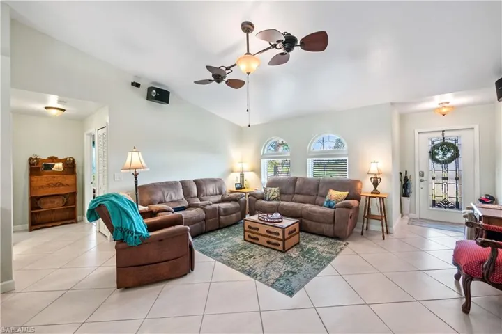 Spacious Living Room with Impact Windows and Vaulted Ceilings