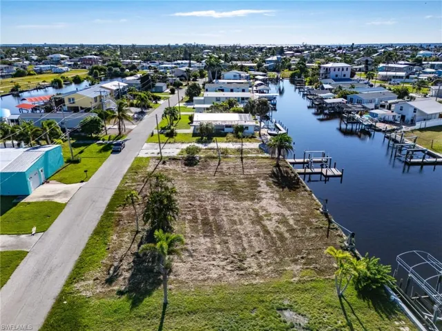 Aerial perspective of suburban area featuring a large body of water