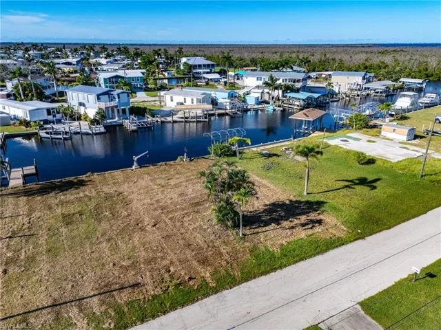 Aerial view of residential area with a large body of water