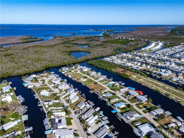 Aerial perspective of suburban area with a large body of water