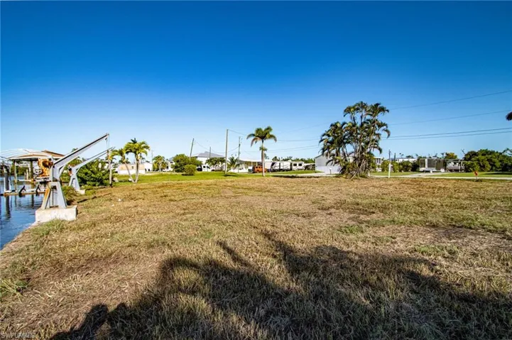 View of green lawn with boat lift