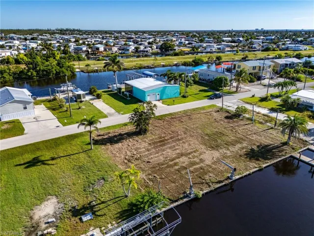 Aerial perspective of suburban area with a nearby body of water