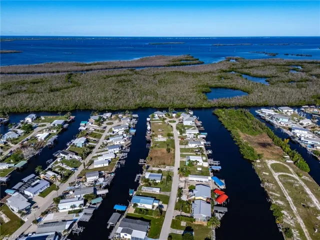 Aerial perspective of suburban area with a large body of water