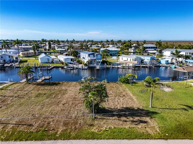 Water view with nearby suburban area and a boat dock