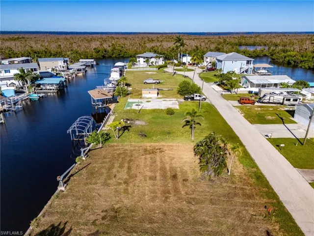 Aerial perspective of suburban area with a nearby body of water