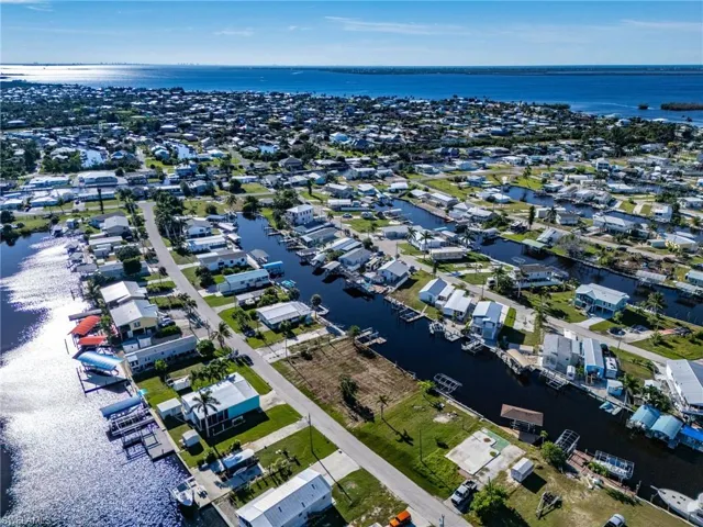 Aerial perspective of suburban area with a nearby body of water