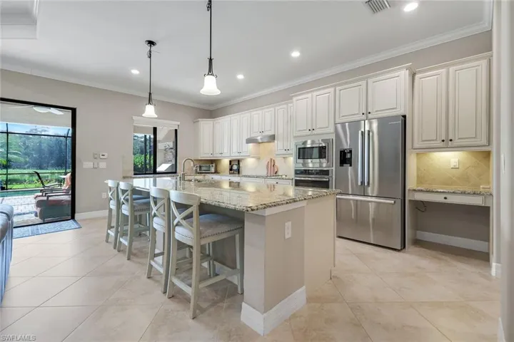 Loaded with cabinets and a large Island