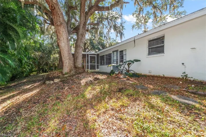 View of yard with a sunroom