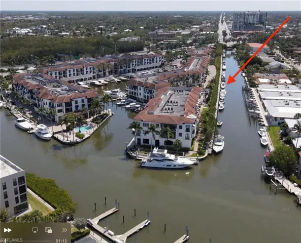 Aerial view Slip C-7 in Curlew Canal at The Naples Bay Resort