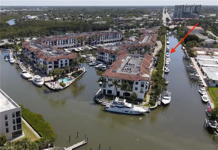 Aerial view Slip C-7 in Curlew Canal at The Naples Bay Resort