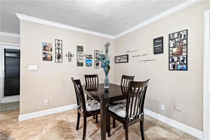 Dining space with ornamental molding