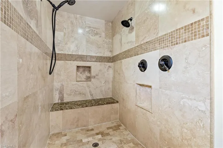 Bathroom featuring a tile shower
