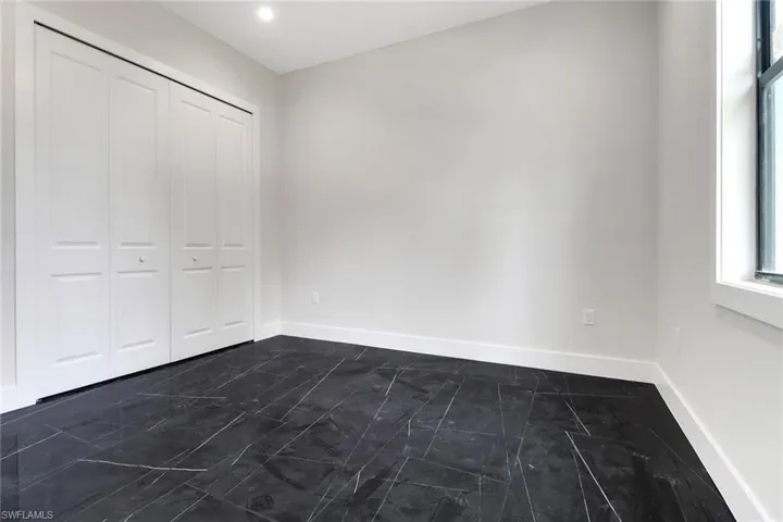 Guest bedroom with tile floors