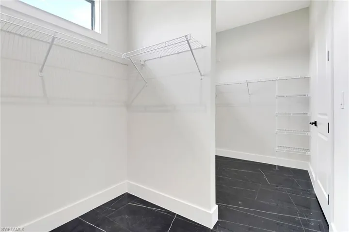Primary bedroom includes a spacious walk in closet