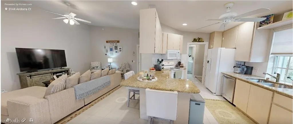 Bedroom featuring ceiling fan and baseboards