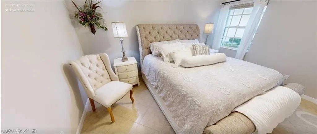 Bedroom featuring baseboards and tile patterned floors