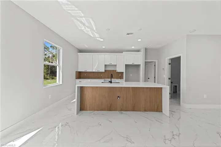 Kitchen finishes and backsplash may differ