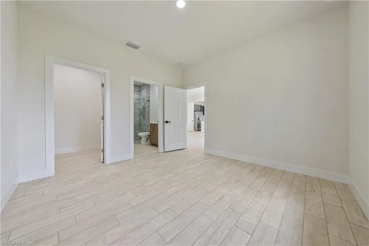 Primary room with light wood-style flooring and baseboards