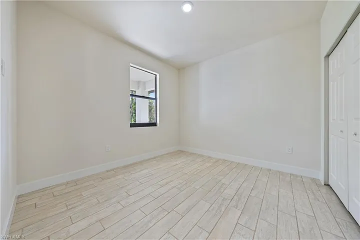 Empty room with light wood-style flooring
