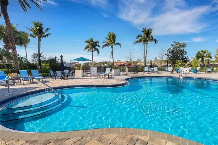 Community pool with a patio area