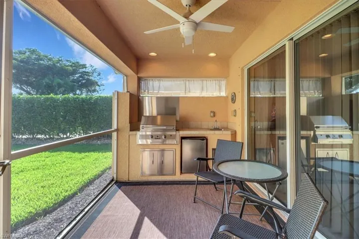 Sunroom / solarium featuring a sink