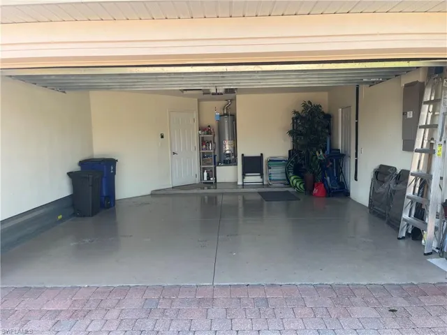 Garage with electric panel and water heater
