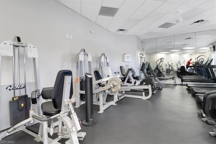 Workout area featuring a drop ceiling