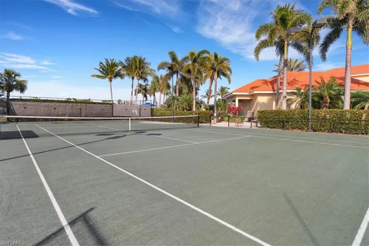 View of tennis court featuring community basketball court