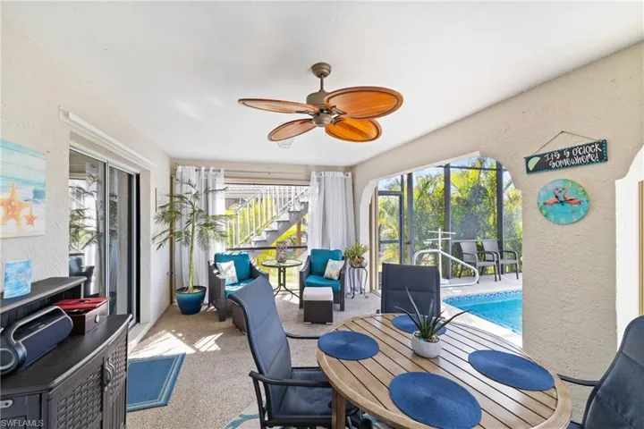 Sunroom featuring ceiling fan